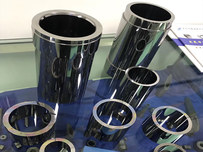Tungsten carbide wear parts for oil and natural gas